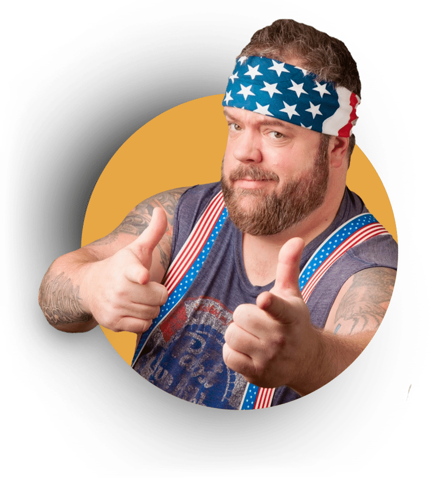 A man with a beard, wearing an American flag bandana and suspenders, points both his index fingers towards the camera against a yellow background.