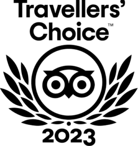 Black and white Travellers' Choice 2023 award logo featuring an owl inside a circle with laurel branches, and text above and below the image.