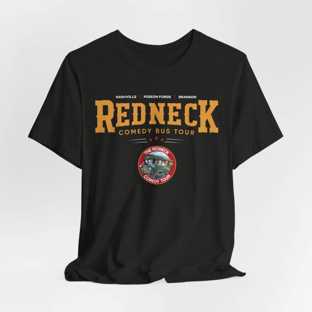 The Redneck Comedy Bus Tour Tshirt is a black tee featuring "Redneck Comedy Bus Tour" text, a list of cities above, and a circular logo with a cartoon bus and the tour name beneath the main text.