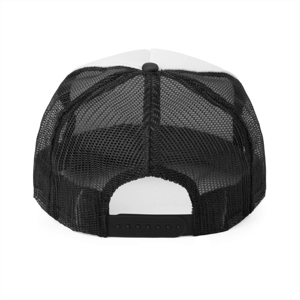 The Redneck Comedy Tour Trucker Cap - Black & White shown from the back, featuring black see-through mesh and an adjustable plastic snap closure.