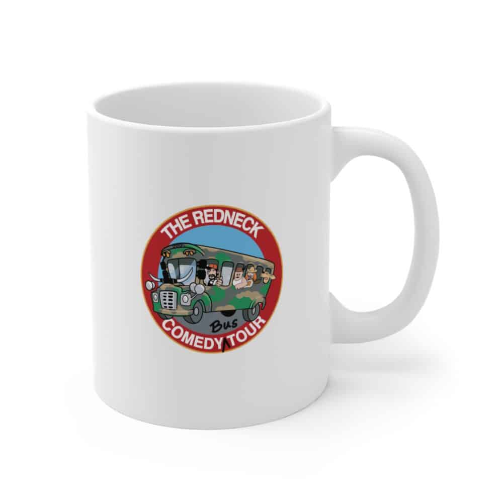 White "We Aint' Fancy" coffee mug featuring a colorful logo with cartoon characters on a bus and "The Redneck Comedy Tour" text on the front.