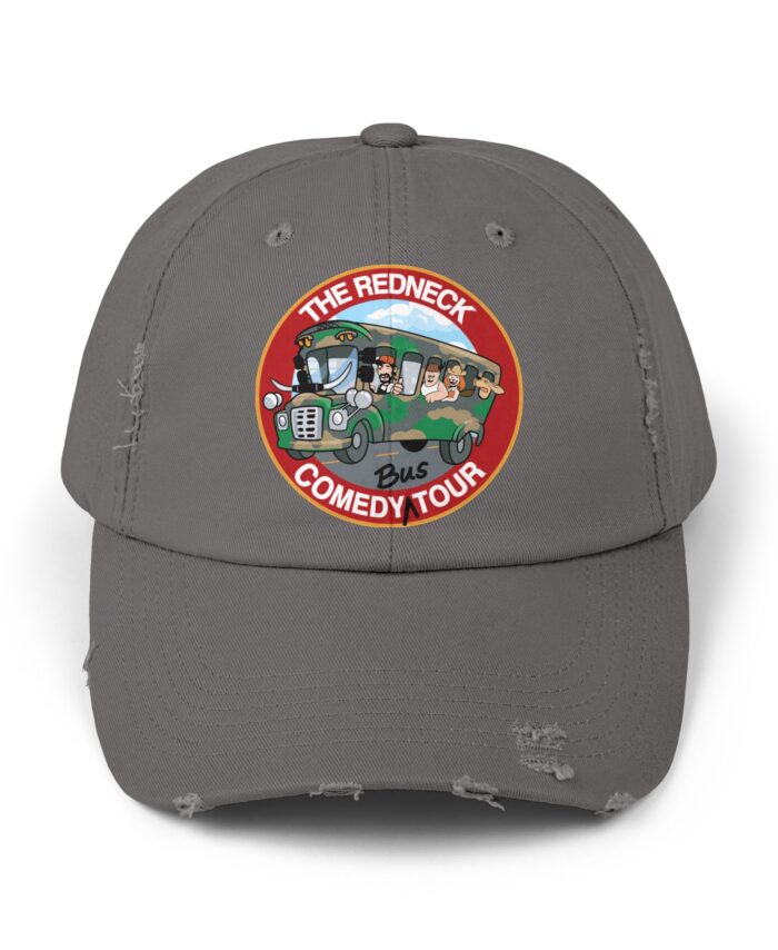 The Redneck Comedy Tour Distressed Hat is a gray baseball cap with a round patch showing cartoon characters on a bus and the text "The Redneck Comedy Tour.