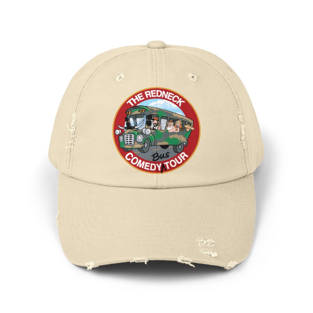 Beige Redneck Comedy Tour Distressed Hat featuring a round patch with a cartoon bus and characters, labeled "The Redneck Comedy Tour Bus.